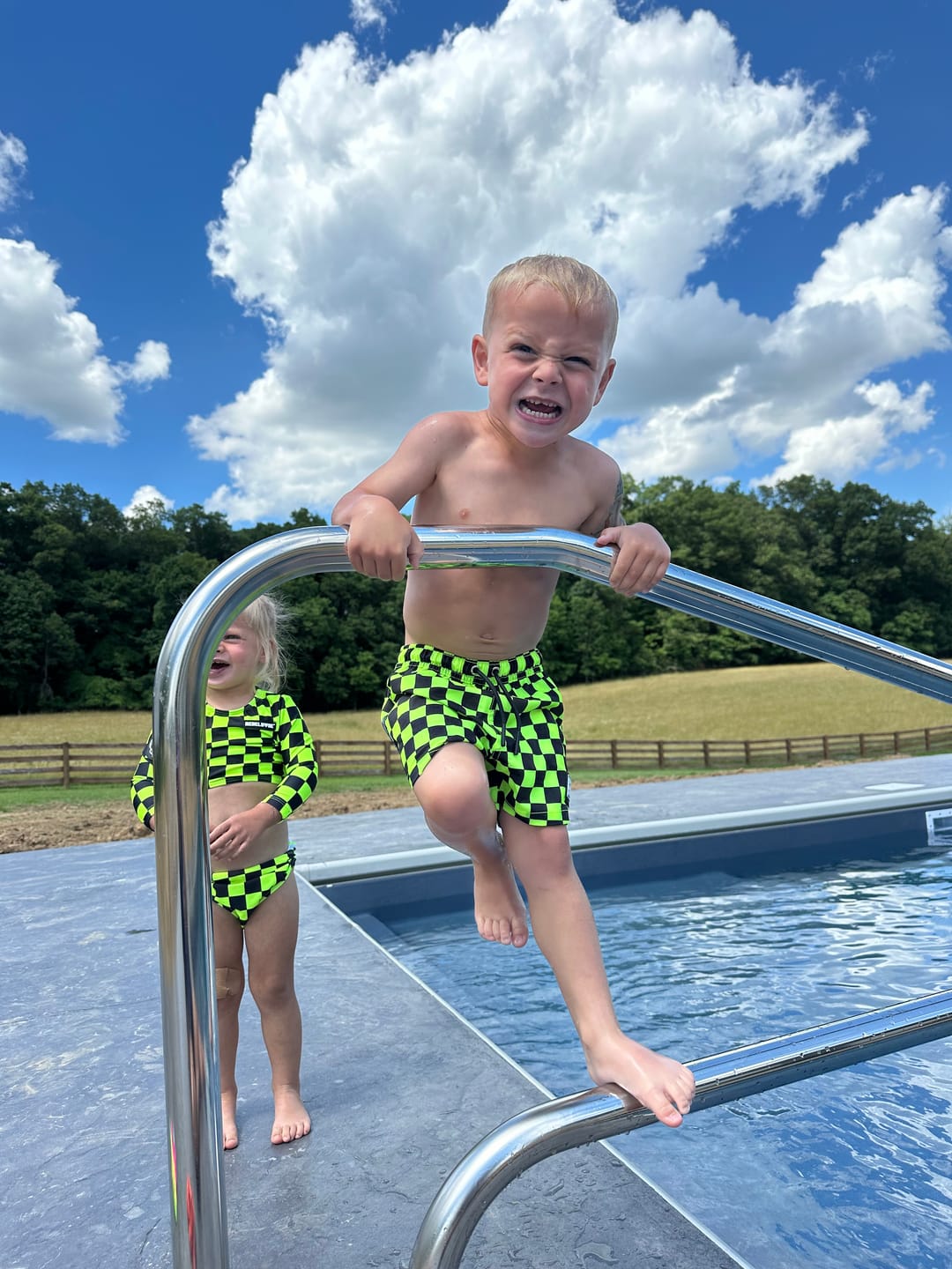 Customer photo review of Hybrid Swim Trunks in Neon Electric Lime + Black Checkered