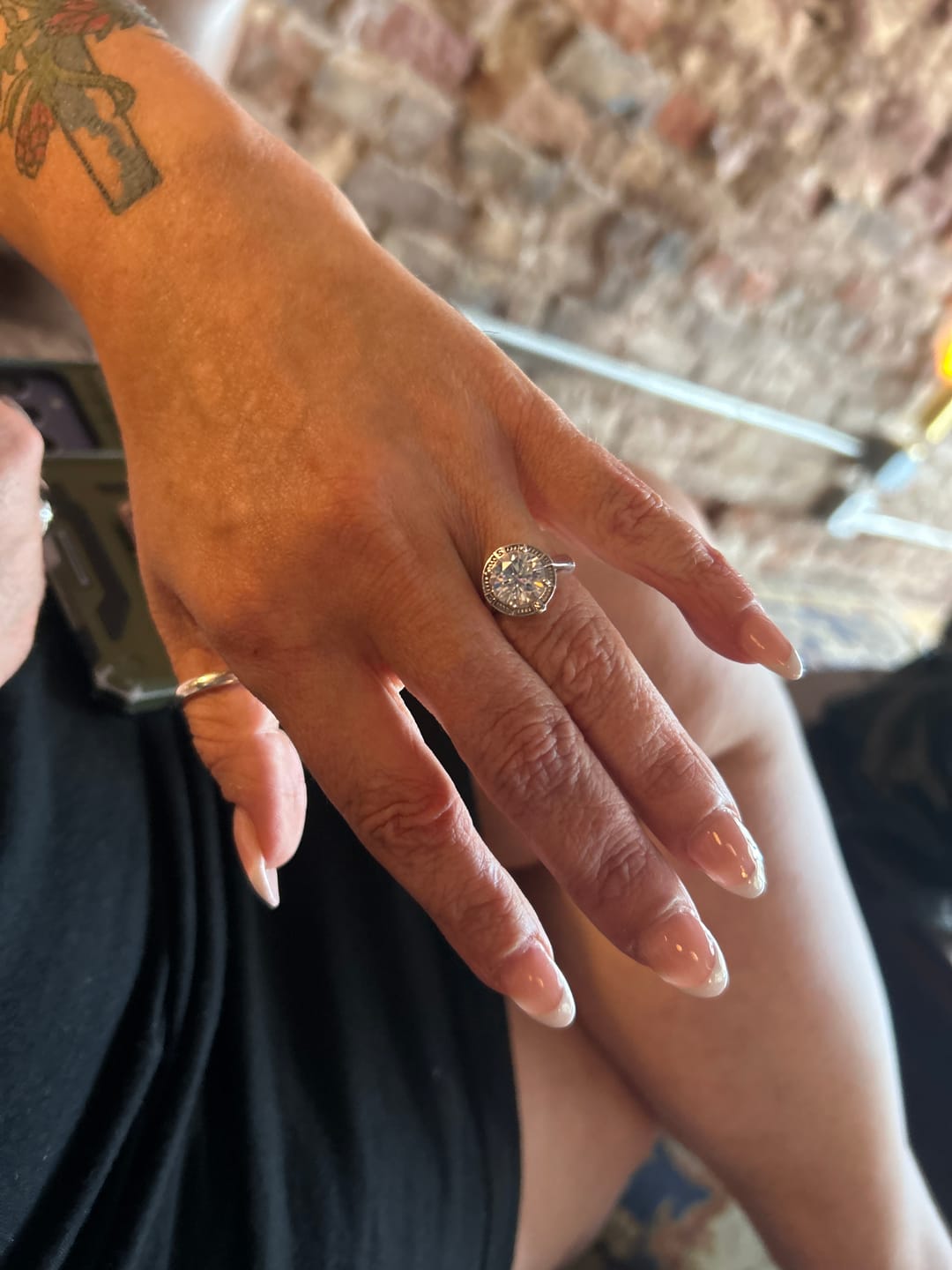 Customer photo review of North Star Halo Compass Solitaire Moissanite Engagement Ring