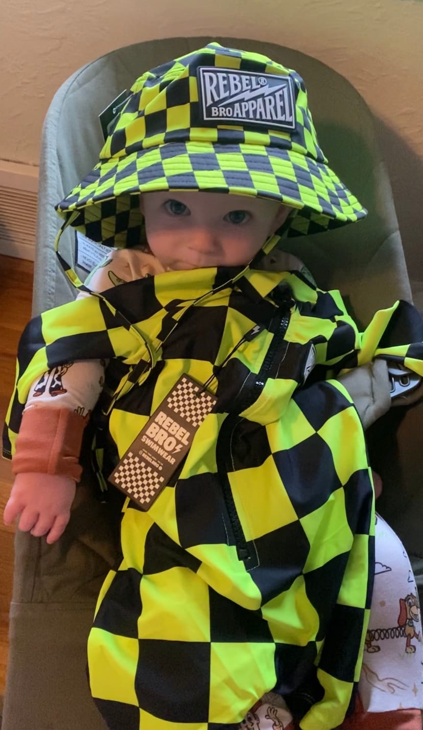 Customer photo review of UPF50+ Boys Swim Romper in Neon Electric Lime + Black Checkered