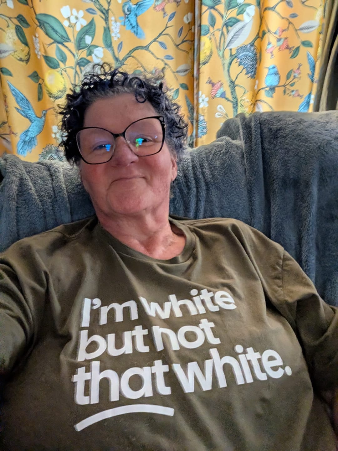 Customer photo review of Racism Is the Only Invention White People Won’t Take Credit For Unisex Tee