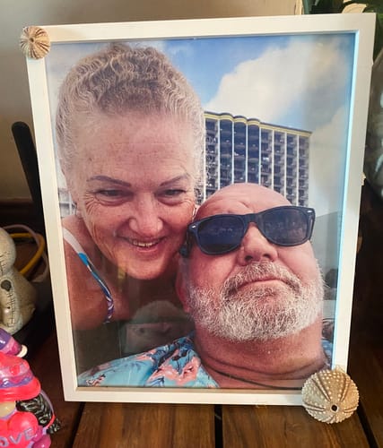 Reviewer's personal framed photo showing her and her late husband on their last vacation together.