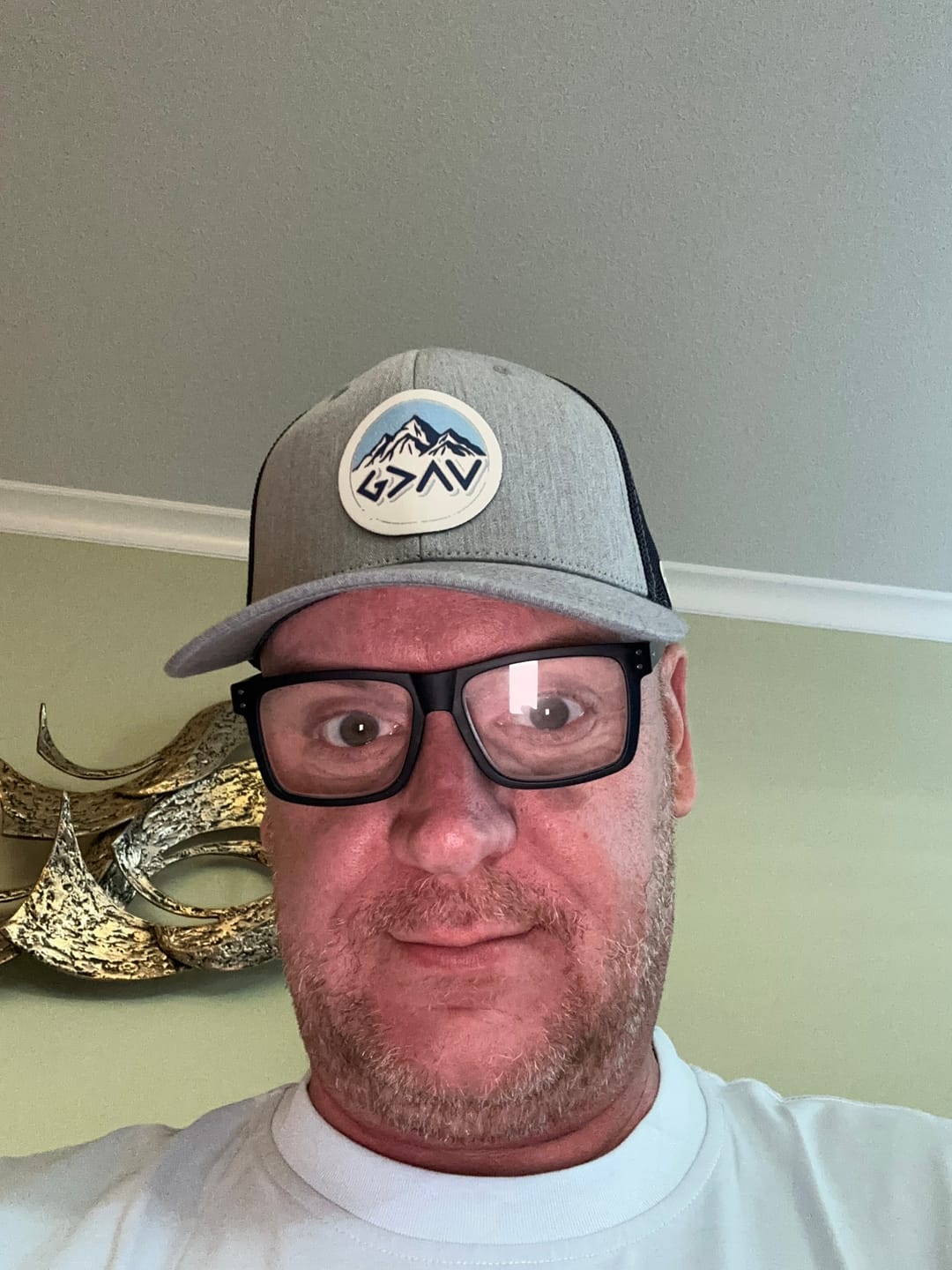 Customer photo review of God Is Greater Than The Highs And Lows Mountain Circle Patch Hats