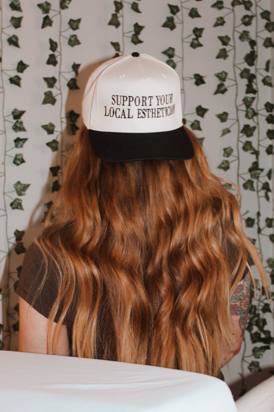 Customer photo review of Support Your Local Esthetician - Trucker Hat