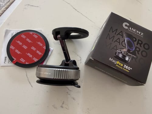 Customer's Casence MagPro Phone Holder unboxed on a counter with its packaging and adhesive disc.
