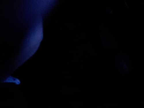 Reviewer's unclear photo of a surface under a blue light.