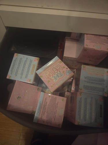 Customer's drawer filled with multiple boxes of Tone Me On Hydrating Toning Pads.