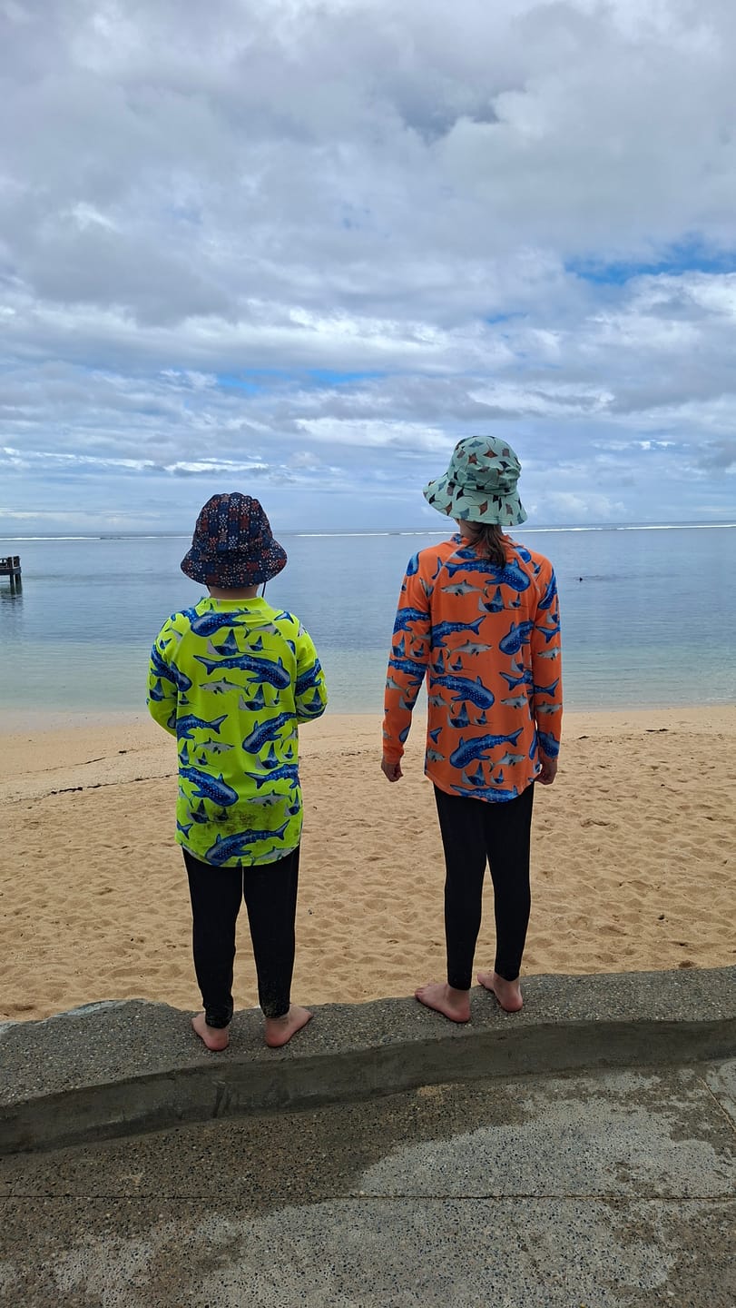 Customer photo review of Fluro Orange Sharks Kids' Rash Top