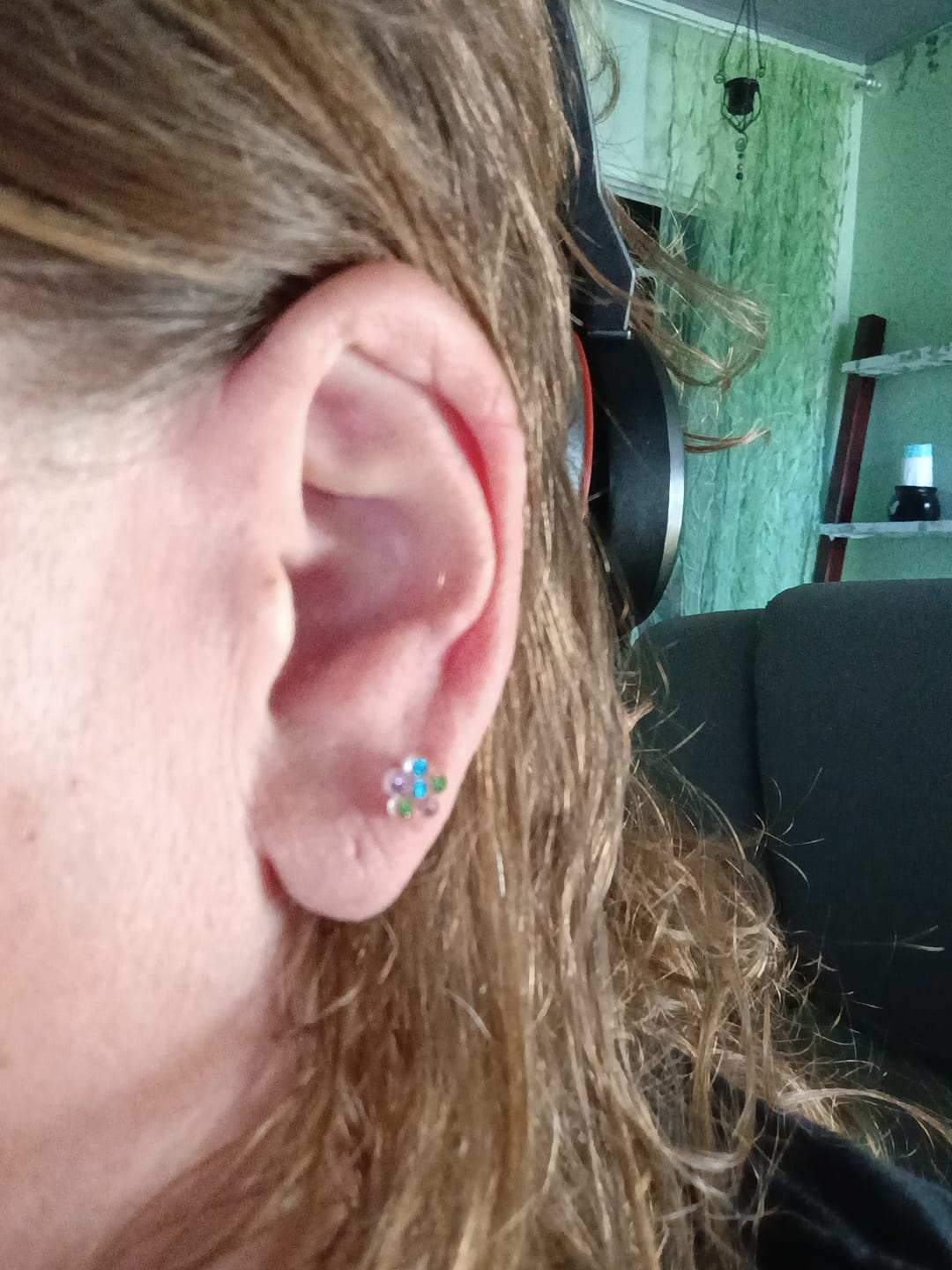 Customer photo review of Tiny Rhinestone Flower Earrings Studs