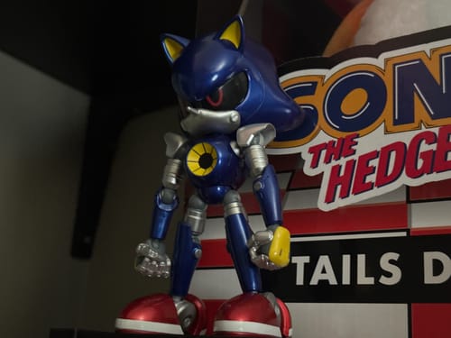 Reviewer's Modern Metal Sonic figure displayed on a shelf in front of its packaging.
