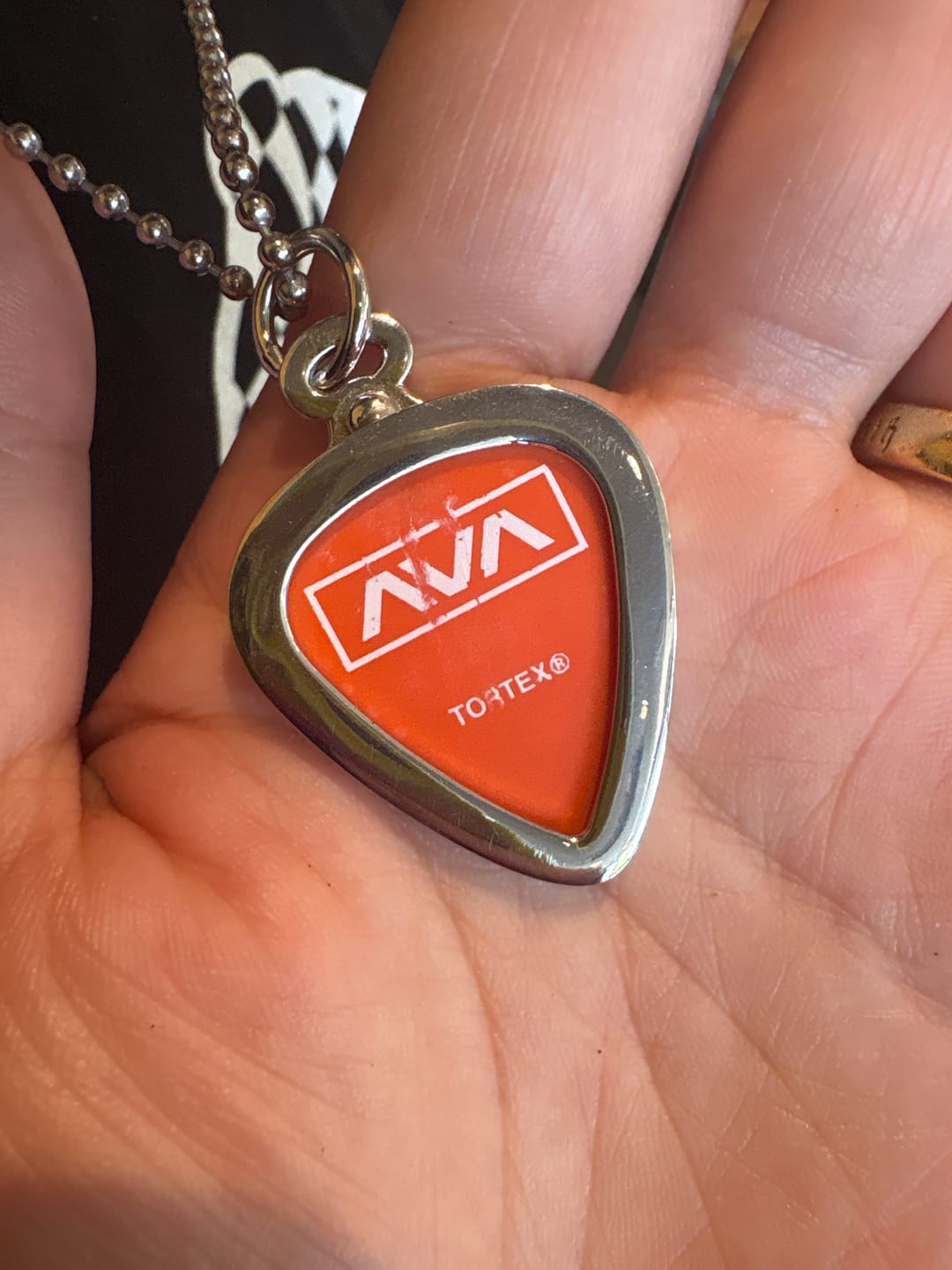 Customer photo review of James Guitar Pick Pendant