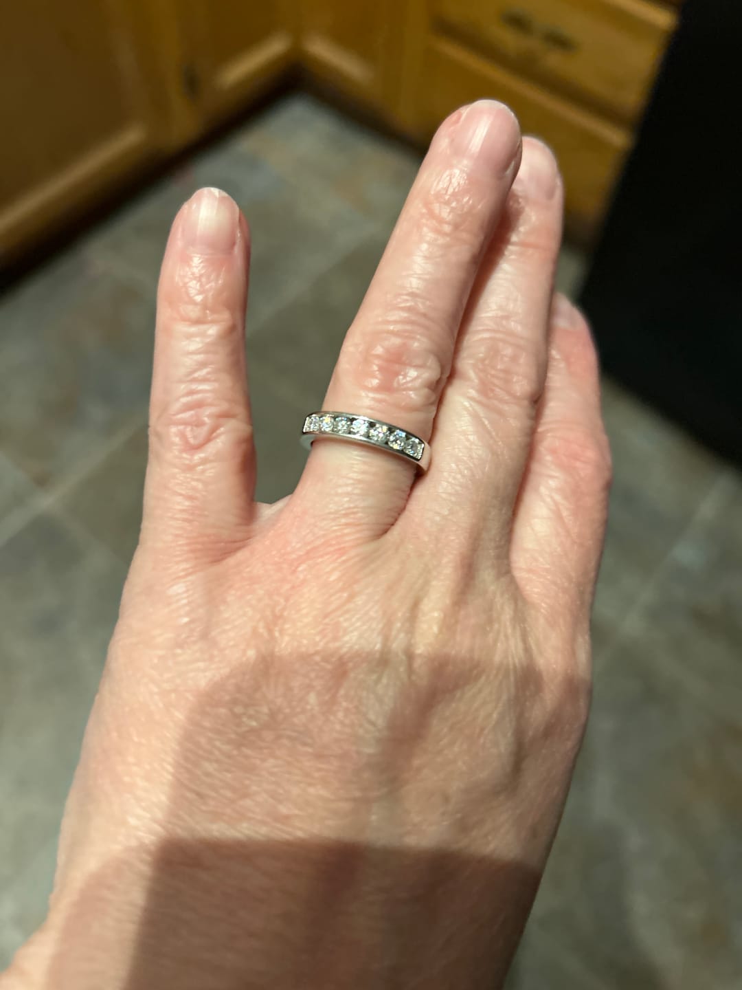 Customer photo review of Channel Set Moissanite Half Eternity Wedding Band Ring In Sterling Silver