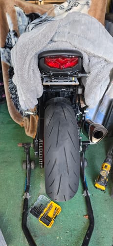 Customer's Yamaha MT09 shown from the rear on a paddock stand, highlighting a newly installed tail section.