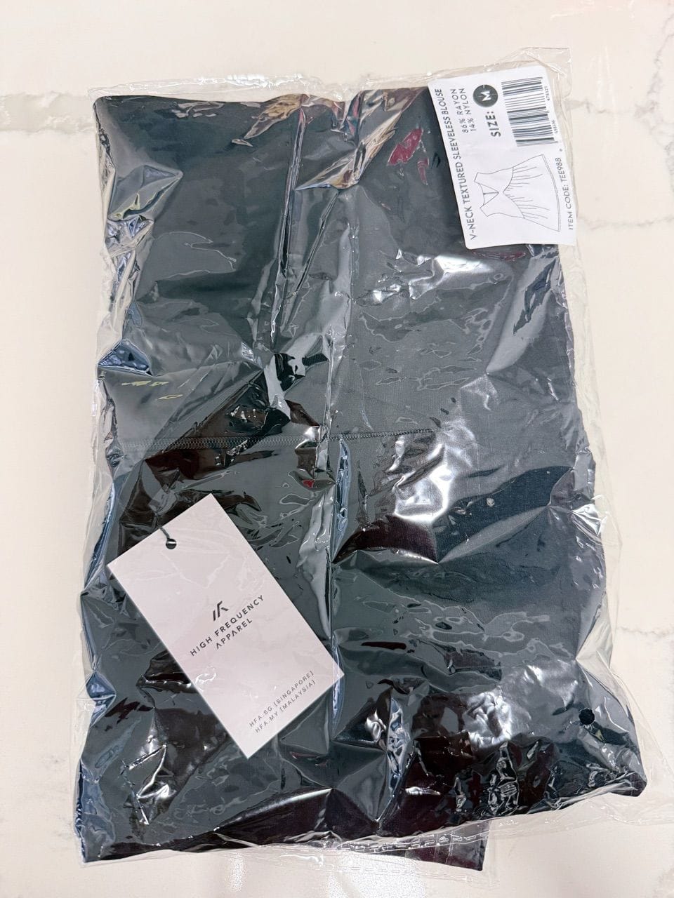 Customer photo review of V-Neck Textured Iron-Free Sleeveless Blouse