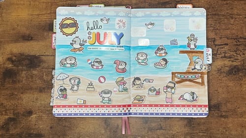Customer's journal showing a colorful beach scene for July created with the Independence Day BBQ Sticker Set.