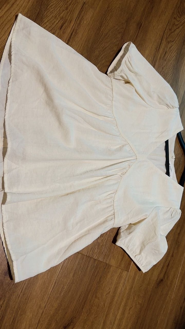 Customer photo review of V-Neck Short Sleeve Flowy Babydoll Blouse