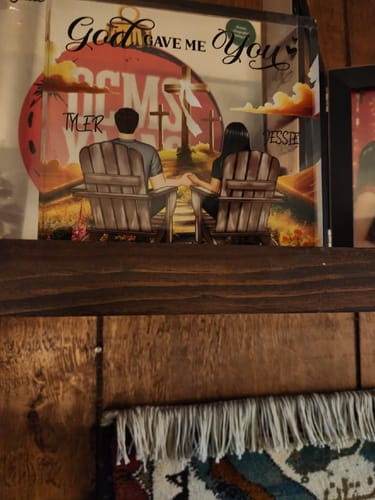 Customer's personalized acrylic block plaque with a romantic illustration, displayed on a wooden shelf.