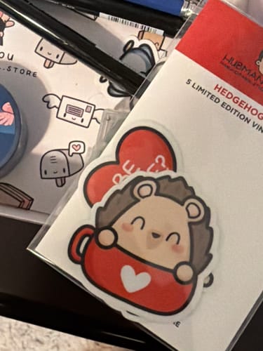 Customer's Hedgehog Love sticker pack featuring a cute hedgehog in a red mug.