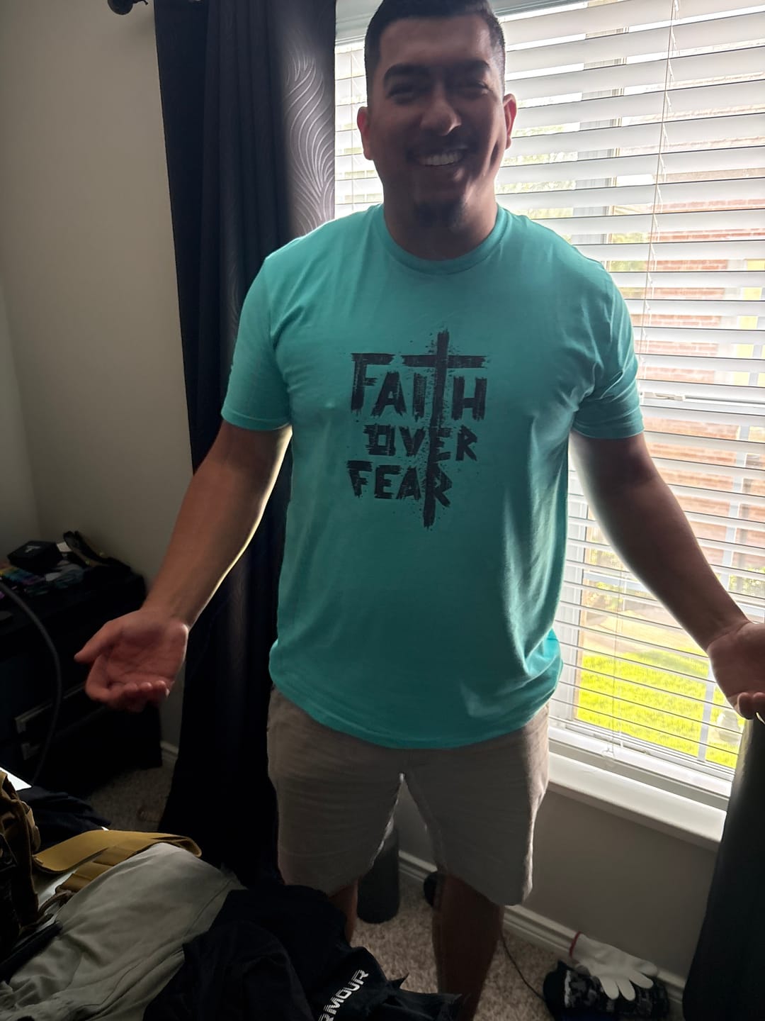 Customer photo review of Faith Over Fear Tee