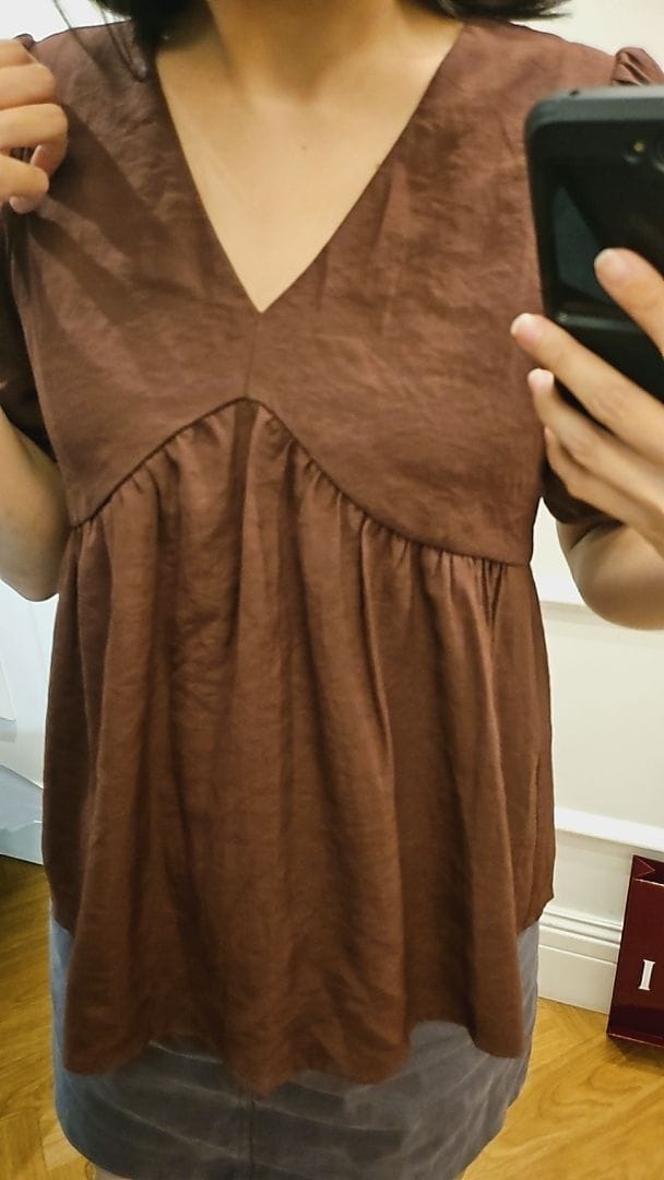 Customer photo review of V-Neck Short Sleeve Flowy Babydoll Blouse