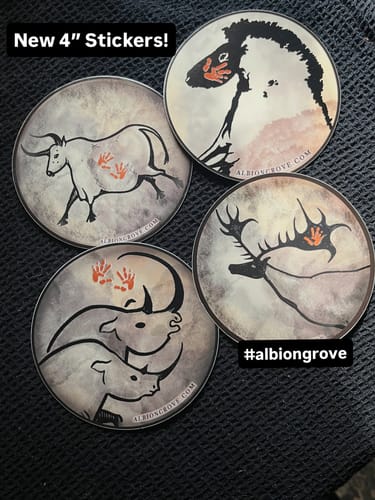 Customer's four round custom vinyl stickers with unique cave-painting style animal art.