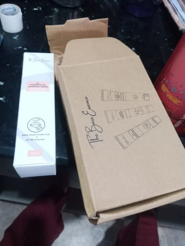 Customer's Advance Lip Pigmentation Cream in its white box, shown next to the brown shipping carton.