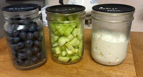 Customer shows three mason jars of food with chalkboard lids neatly labeled using the Liquid Chalk Pens.