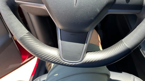 Customer photo review of Real Molded Carbon Fiber Lower Steering Wheel Overlay for Tesla Model Y 2020-2026