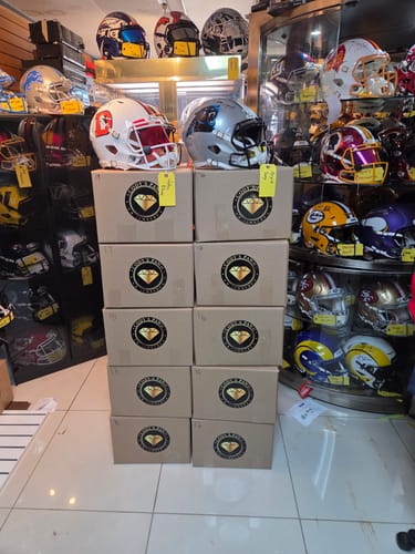 Customer's cut to shape stickers applied to stacked cardboard packages in their business.