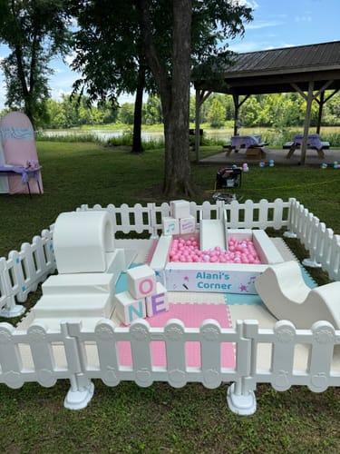Customer's colorful Big EVA Mats used as the floor for a child's outdoor soft play pen.