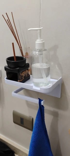 Customer photo review of Wall-Mounted Toilet Paper Holder with Storage Shelf