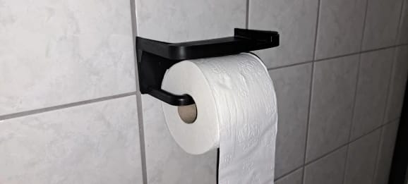Customer photo review of Wall-Mounted Toilet Paper Holder with Storage Shelf