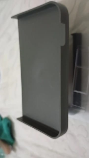 Customer photo review of Wall-Mounted Toilet Paper Holder with Storage Shelf