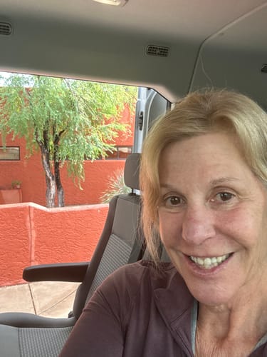 A close-up selfie of a smiling reviewer, pleased with the skin results from The Micro Infusion System.