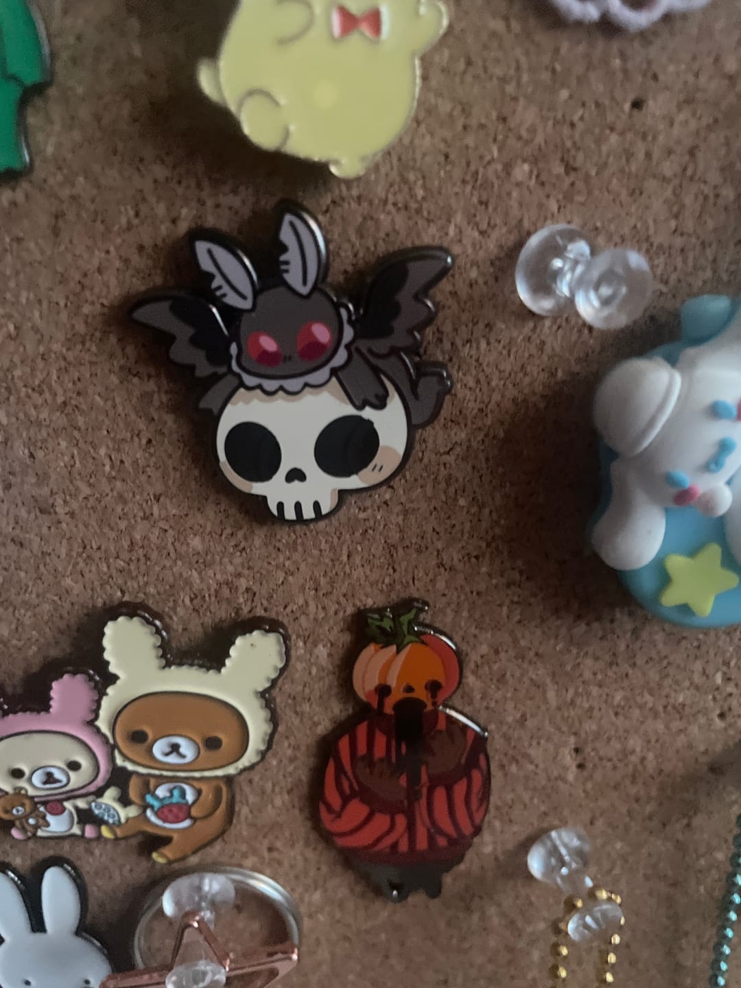 Customer photo review of Mothman Skull Enamel Pin!
