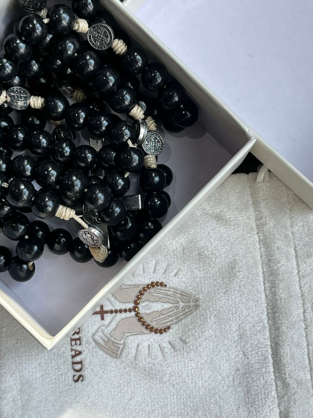 Customer photo review of SolaceBeads 15/20 Decade Ebony Wood Rosary With St. Benedict Medals & Crucifix: Protective Strength