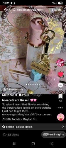 Customer's Personalised Stay Shining Lip Oil with a pink cap and a gold keychain holding a custom engraved 'Melanie' charm.