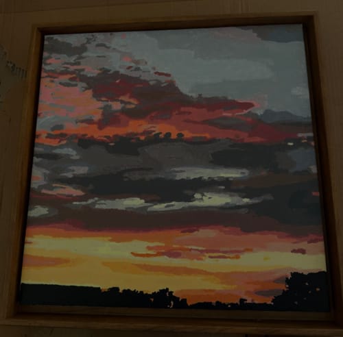A customer's finished Custom Paint By Numbers painting of a vibrant sunset landscape.