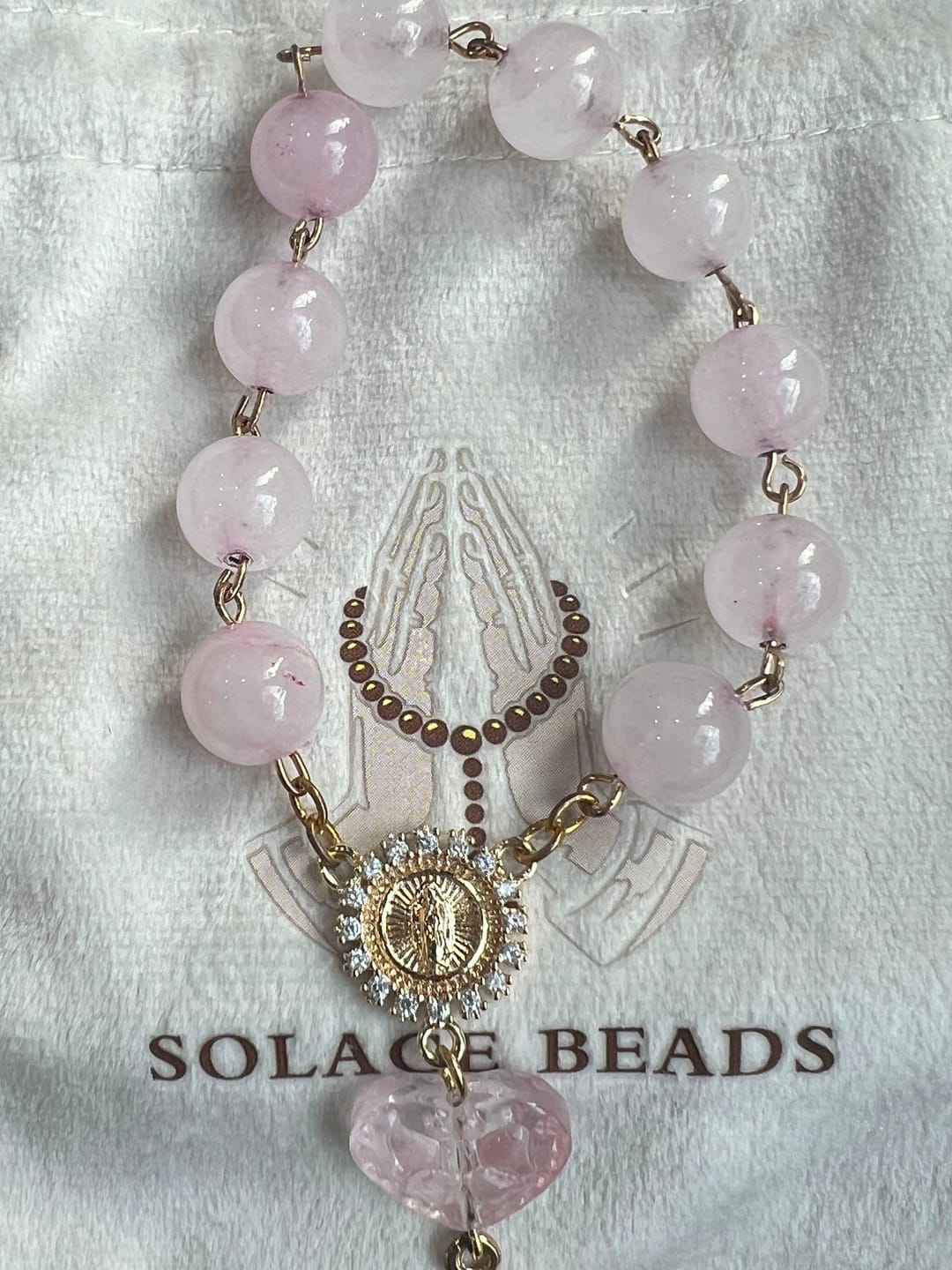 Customer photo review of SolaceBeads Artisan Rose Quartz Pocket Rosary: Soft Pink Beads with Sacred Cross & Marian Accents