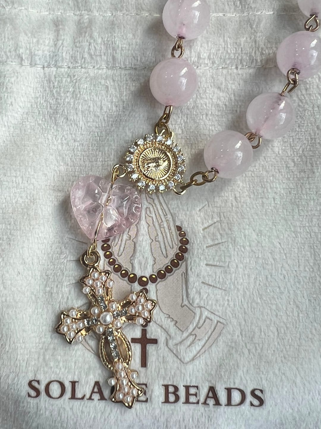 Customer photo review of SolaceBeads Artisan Rose Quartz Pocket Rosary: Soft Pink Beads with Sacred Cross & Marian Accents
