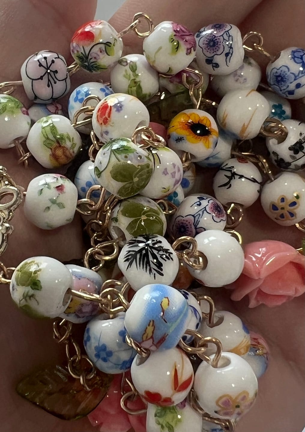 Customer photo review of SolaceBeads Vintage Mixed Floral Ceramic Rosary With Guadalupe & Crucifix: Timeless Garden