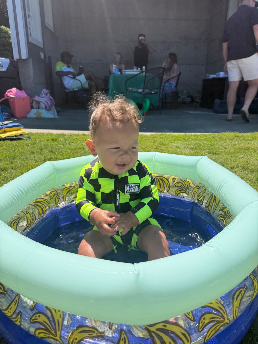 Customer photo review of UPF50+ Boys Swim Romper in Neon Electric Lime + Black Checkered