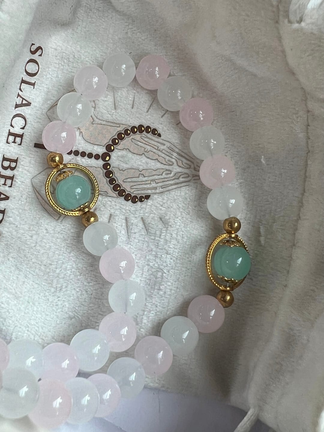 Customer photo review of SolaceBeads Artistic Pink & White Beaded Rosary: A Fusion of Colors & Sacred Symbols