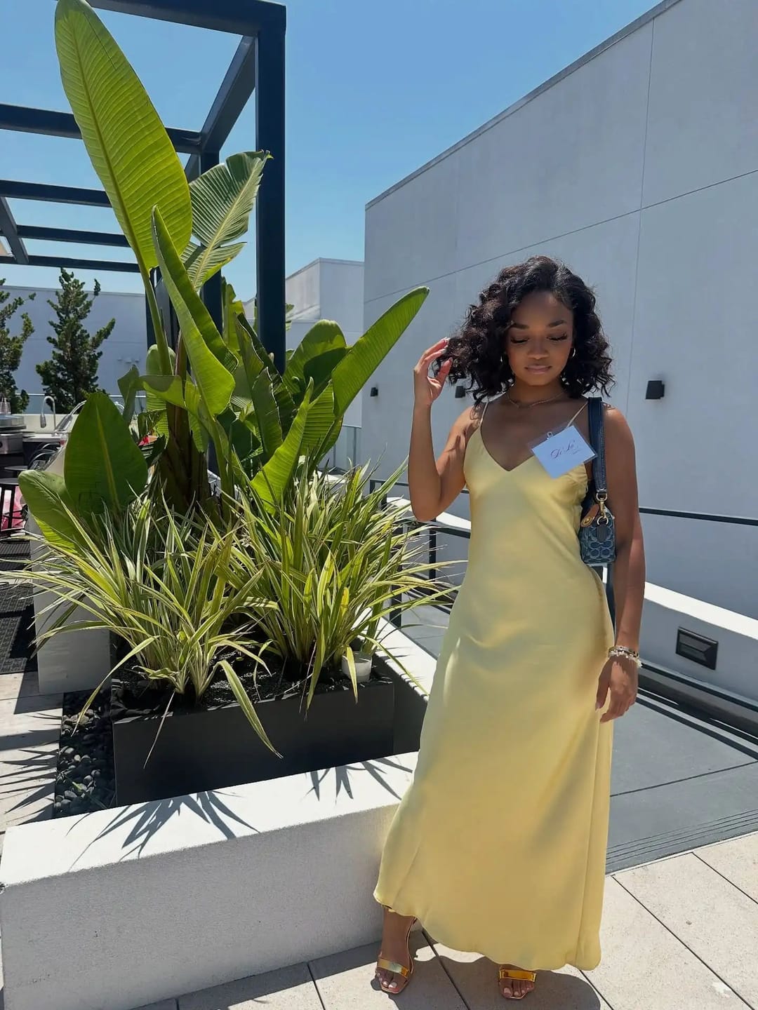 Customer photo review of Kirra Satin Backless Maxi Dress