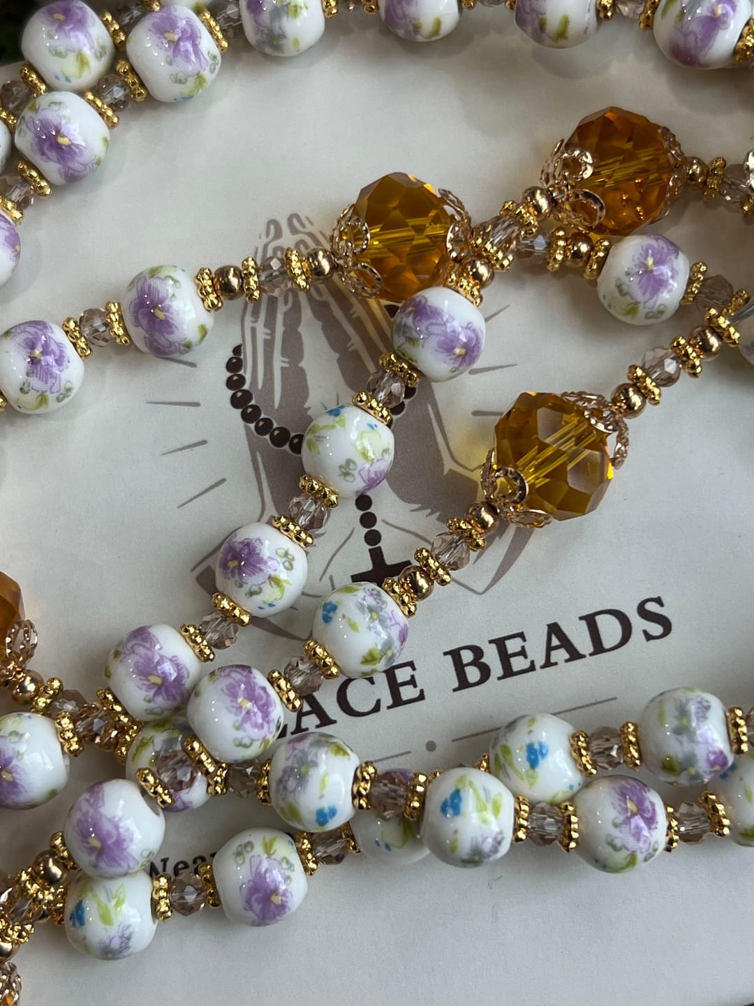 Customer photo review of SolaceBeads Lavender Floral With Golden Sacred Heart & Crucifix Rosary: Faith in Every Bead