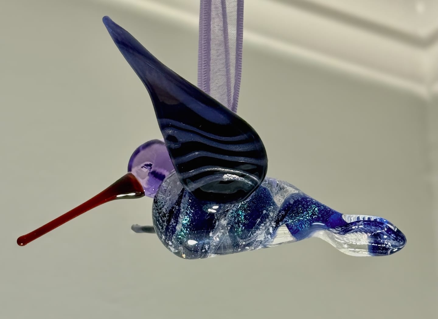 Customer photo review of Purple Dichroic Twist Glass Hummingbird with Infused Ash