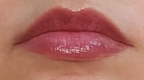 Close-up: Reviewer's lips with freshly applied, glossy Peptide Lip Glaze.