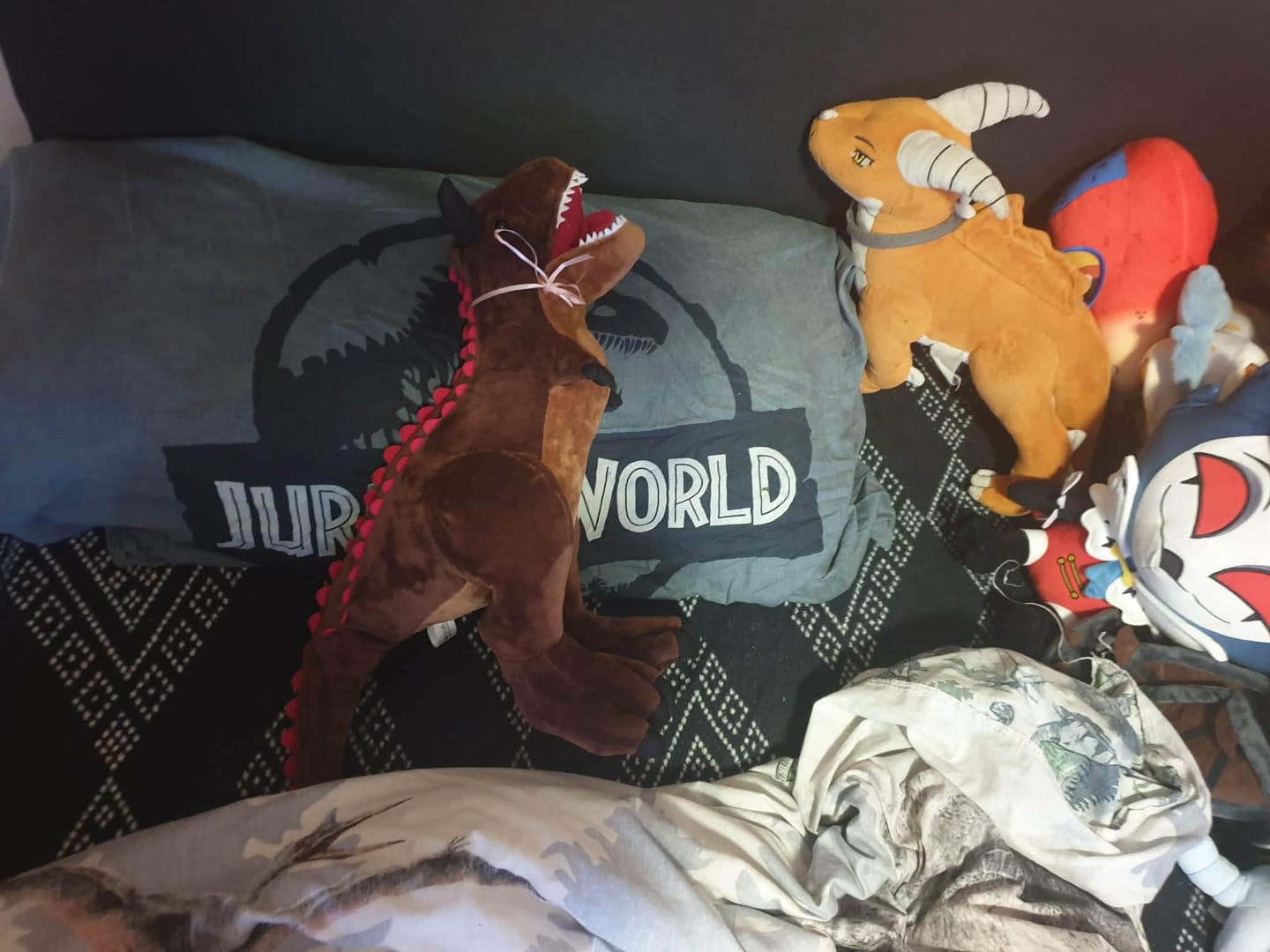 Customer photo review of Carnotaurus Dinosaur Plush Toy – Realistic and Soft Stuffed Prehistoric Animal for Jurassic Fans