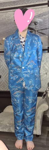 Customer wearing the full blue suit set with a detailed dinosaur print.