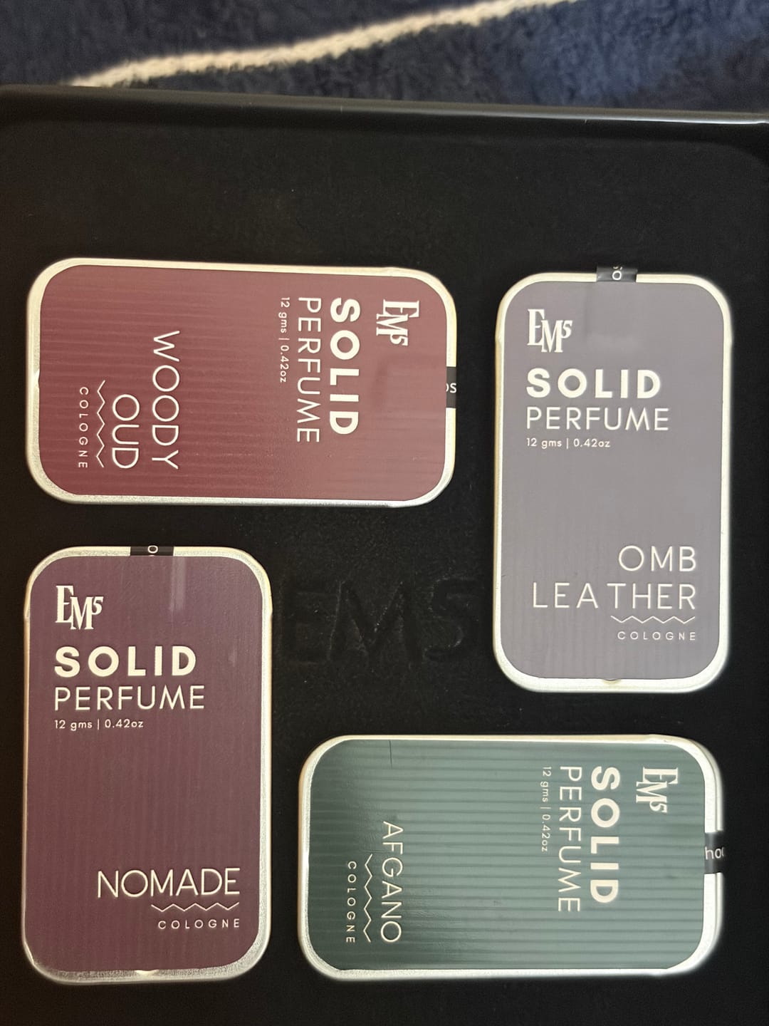 Customer photo review of Masculine Set of 4 Solid Perfumes