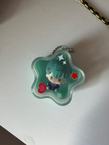 Customer's Alien Stage Star Shaped Pendant blind box prize, showing the cute Till character inside a teal star.